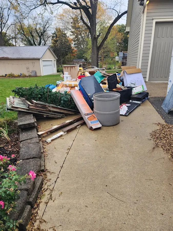 Dumpster being loaded with debris for 30 Yard Dumpster Rental in East Bradford